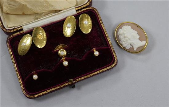 A pair of 18ct and seed pearl cufflinks ( one pearl missing) and four similar dress studs and a small cameo brooch.